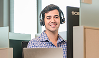 person smiling with headset on